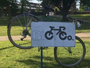 Bicycle on bike stand adorned with BiCi Co banner